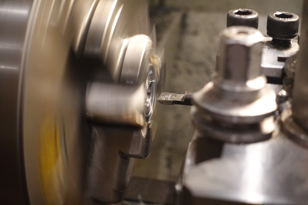 Approaching a part in a spinning chuck with a boring tool