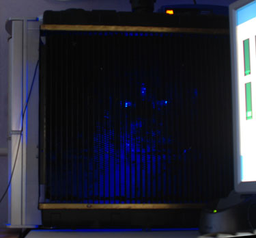 Blue light filters through the radiator on the side of the PC