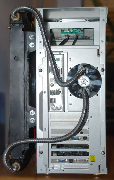 Rear view of the case, with radiator hoses leading to the hard drive platter