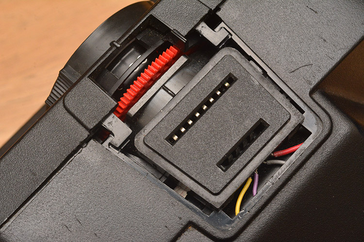 Partly dismantled polaroid camera, view of the flash connector