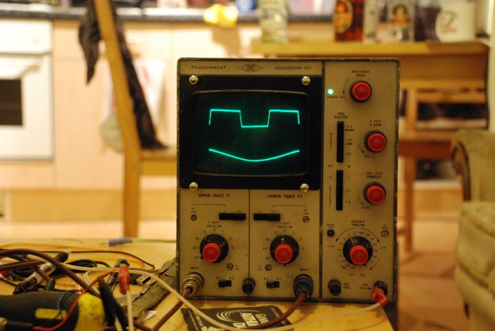 Sine wave and square wave on the scope, looks like a smiling face