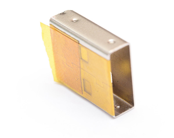 Kapton tape wrapped around metal part of the USB connector