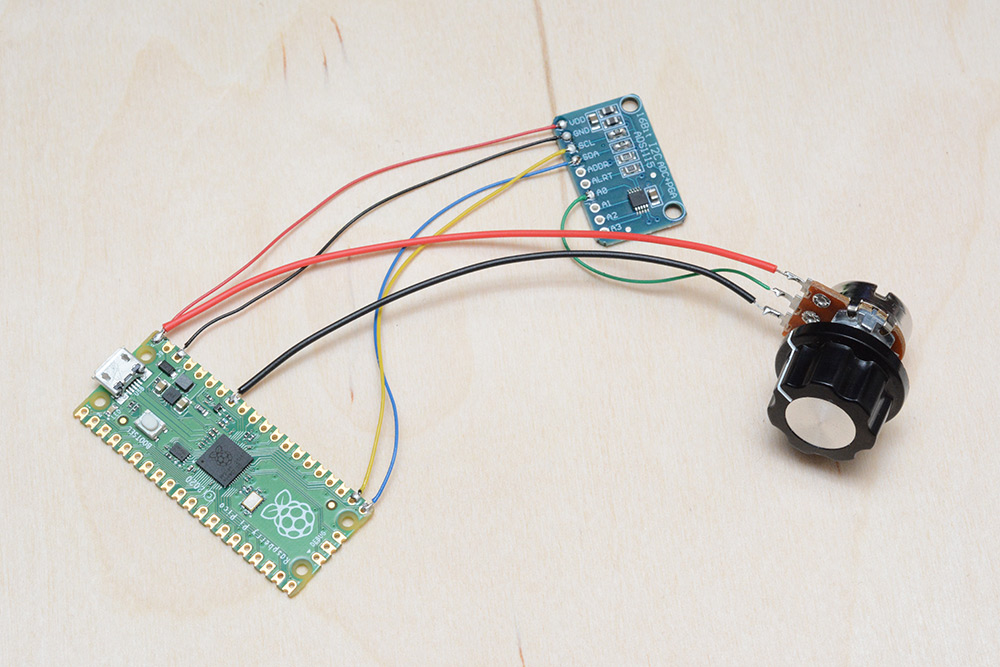 Pico and ADC wired up with a potentiometer to test
