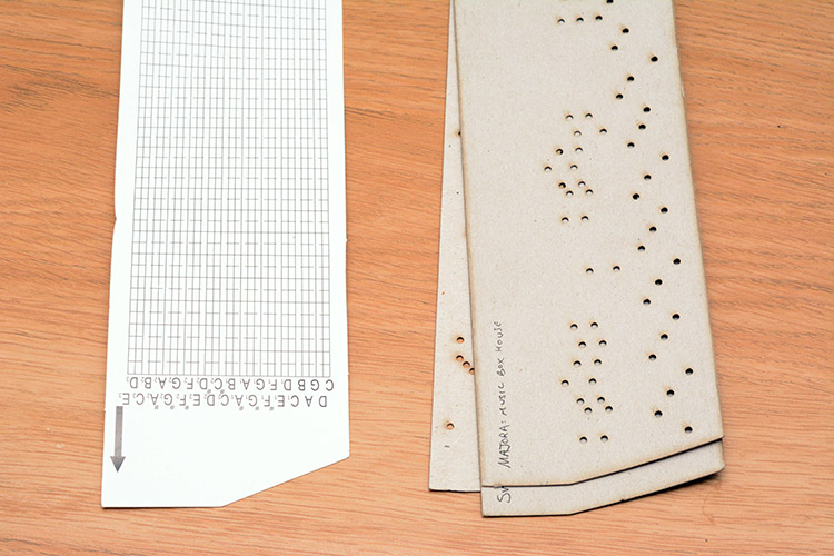 Laser cut punched-card music strips