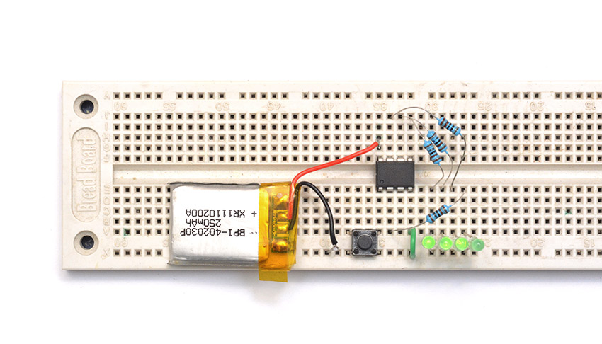 LipoCheck circuit on a breadboard, with three LEDs lit